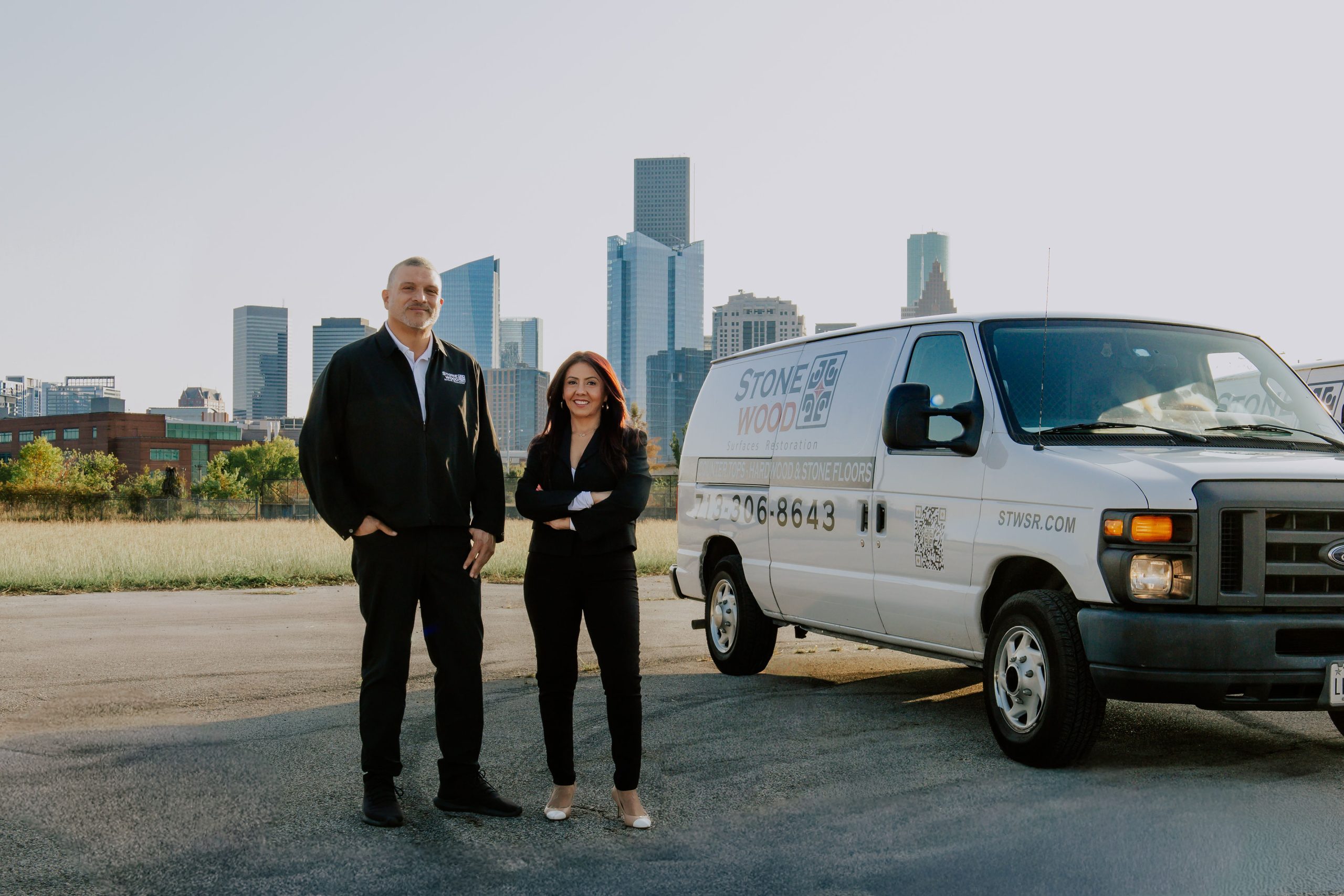 Stonewood founders standing with company service vehicle in Houston TX
