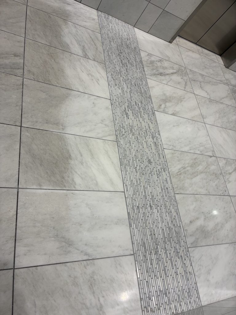 Detail of the marble flooring at Aspire Post Oak